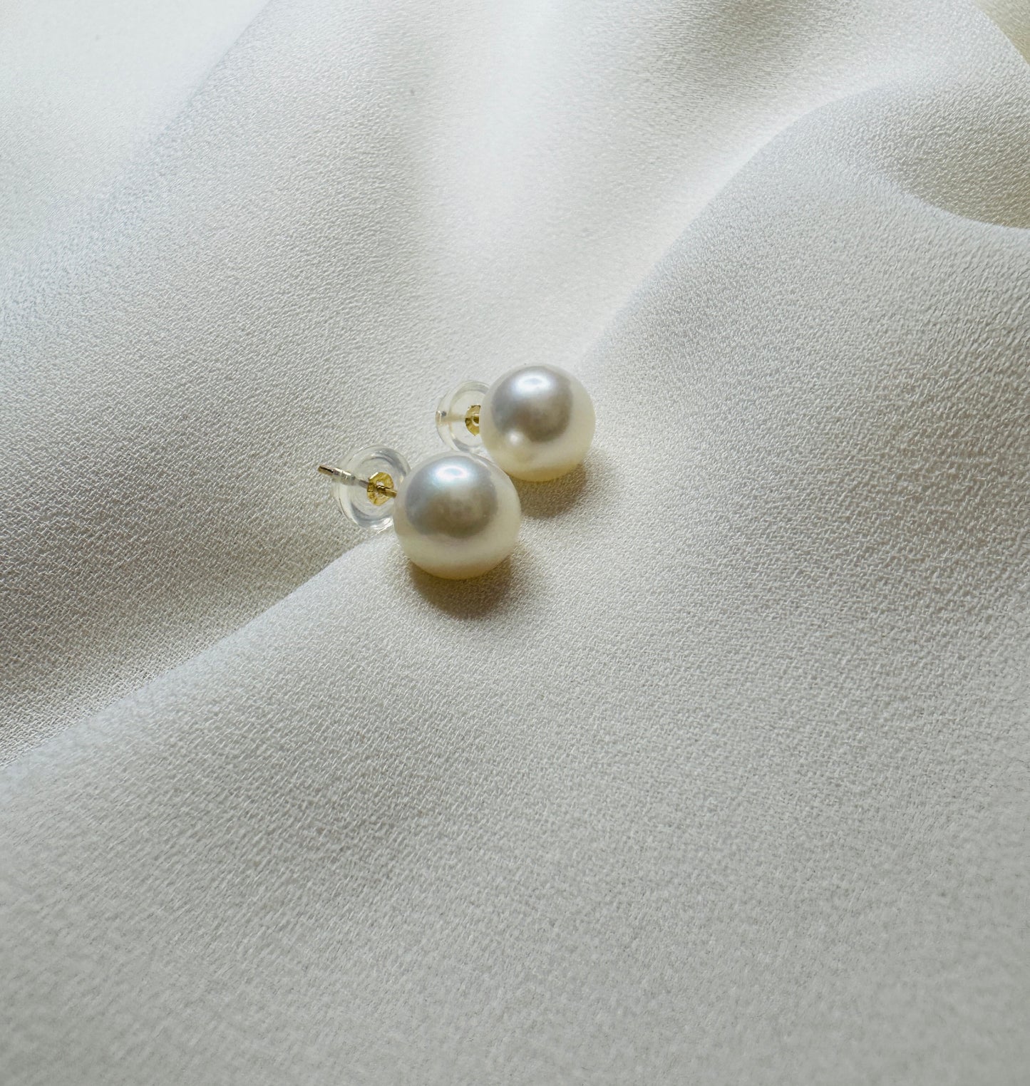 Ivory pearl stud earrings set in 14k gold