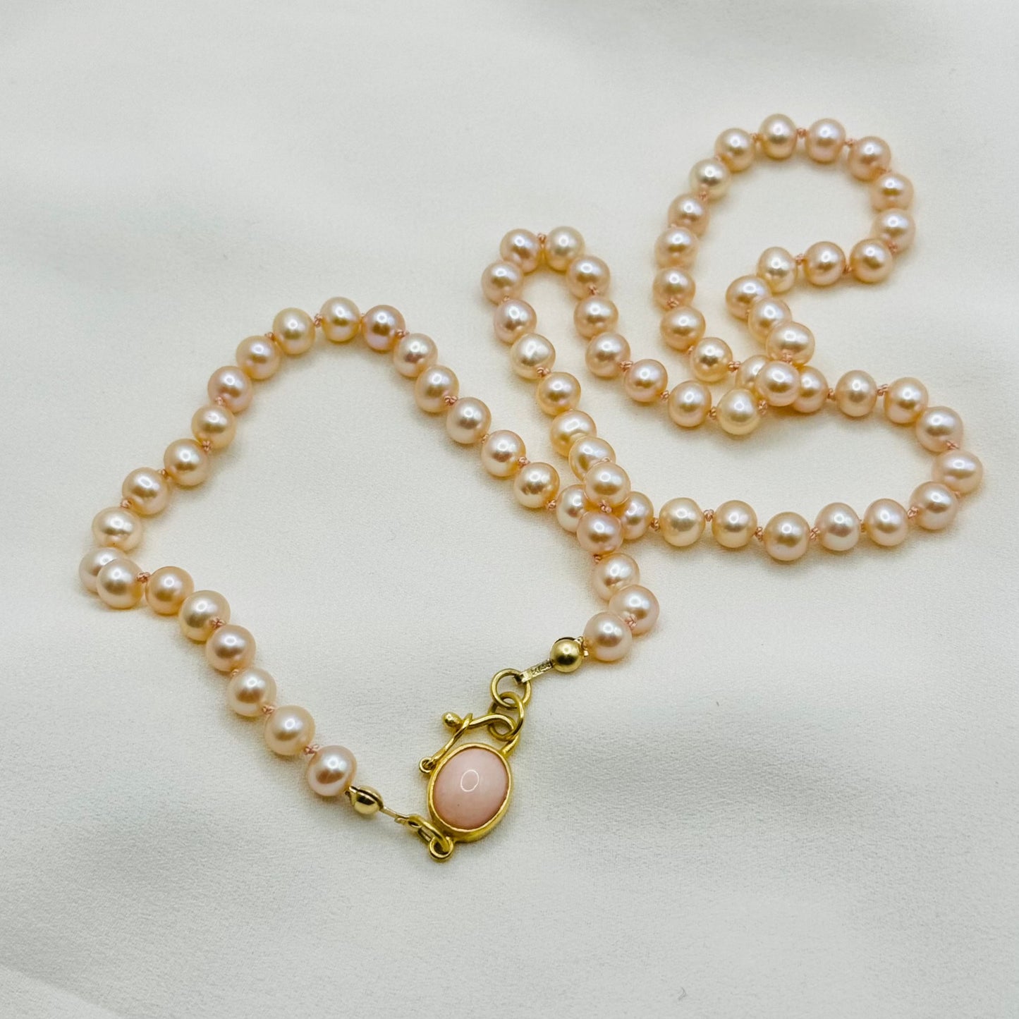 Peachy pink pearl necklace